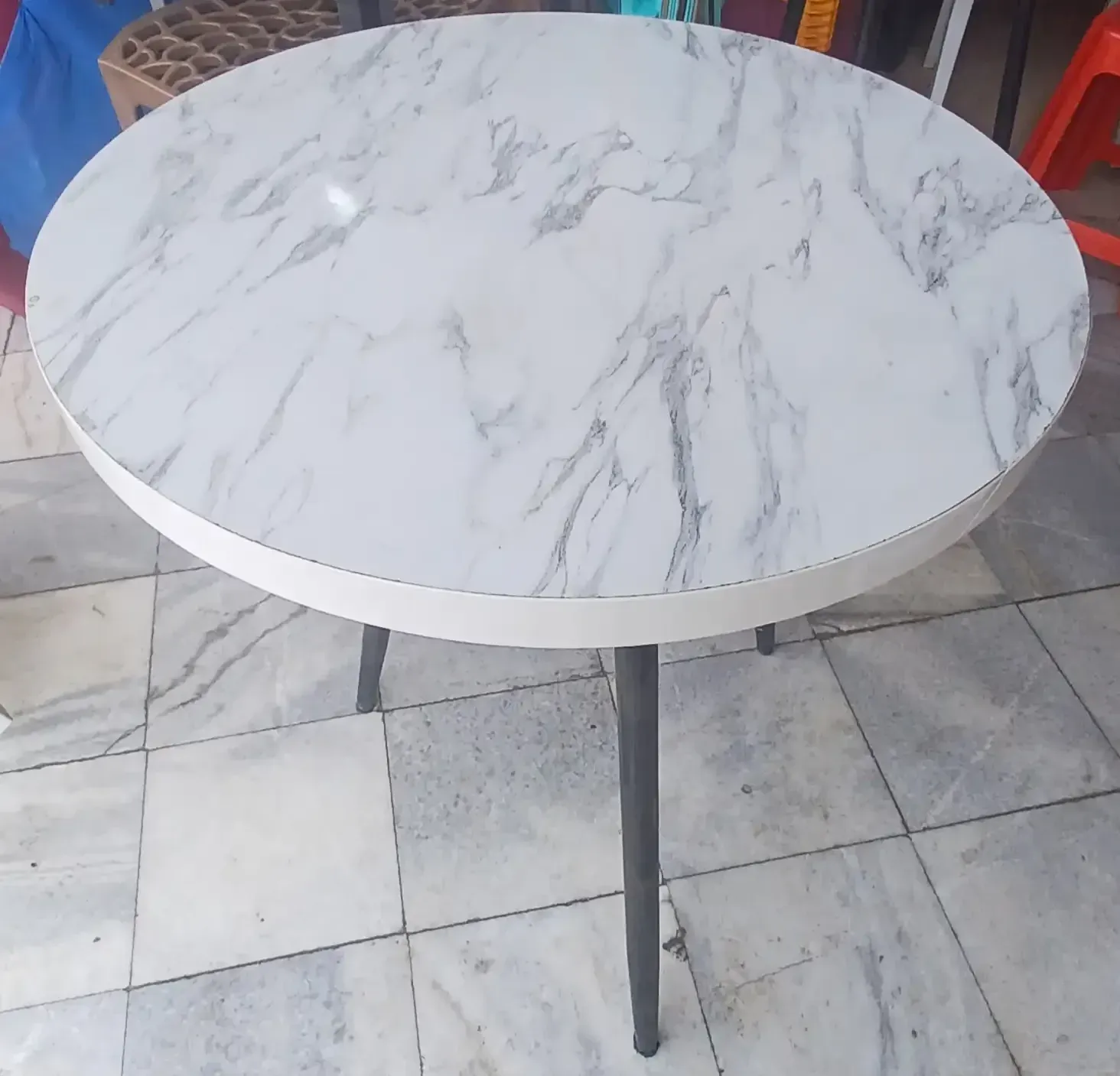 White-Circular-Tri-leg-MDF-Table-1-e1755434518410.webp